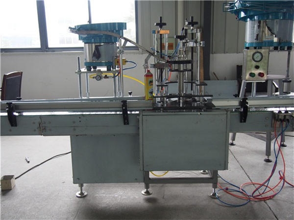 24 buru botila komuneko ura betetzeko makina